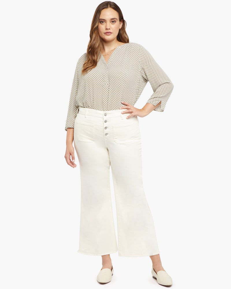 Front of a model wearing a size 14 Major Flare Ankle Jean in Vanilla by NYDJ. | dia_product_style_image_id:170669